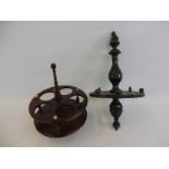 An early Victorian treen cruet or spice stand together with an oak hanging spoon rack.