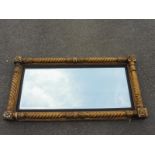A large decorative Georgian carved giltwood rectangular wall mirror with rope twist border, 38 1/4 x