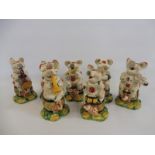A group of seven contemporary and decorative Staffordshire style pig musician figures.