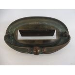 An Art Nouveau oval brass letter box plate, with integral door knocker, 8 1/2" x 5".