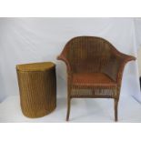 A Lloyd Loom 'Lusty' armchair and matching semi-circular linen basket.