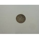 A George III silver shilling, dated 1787, with milled edge, good condition and good tones,