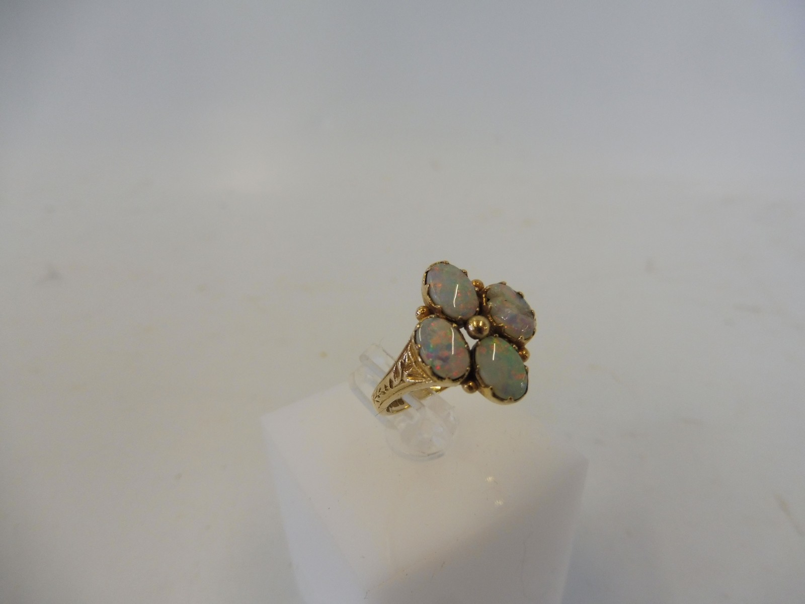 A 9ct gold and opal ring, one of the four stones is damaged, weight approx. 3g. - Image 2 of 2