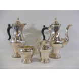 A good silver four piece coffee set, comprising a coffee pot, a hot water pot, a sugar bowl and milk