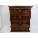 An early 18th Century Italian walnut narrow chest of drawers with ornate brass handles, 30 1/4" w