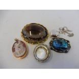 A large agate and gilt framed brooch, a platinum heart shaped locket and various other jewellery