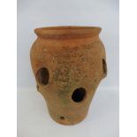 A weathered terracotta strawberry planter, 16" h.