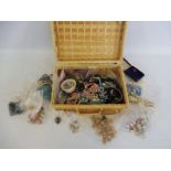 A basket of assorted costume jewellery, including some for restoration.