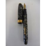 A Conway Stewart fountain pen with a 14ct gold nib.