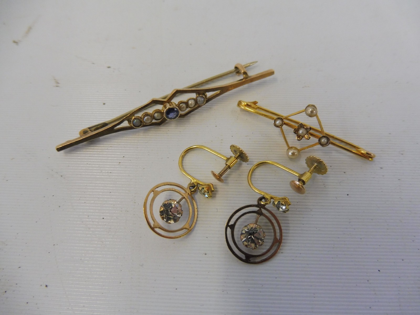 A 9ct gold and seed pearl brooch, one other and a pair of 9ct gold earrings, weight approx. 4g.