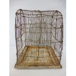 A Victorian folk art wirework hanging bird cage, the base 18 x 18", 22 1/2" h.