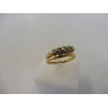 A 9ct gold wedding band and a 9ct and diamond engagement ring, weight approx. 3g.