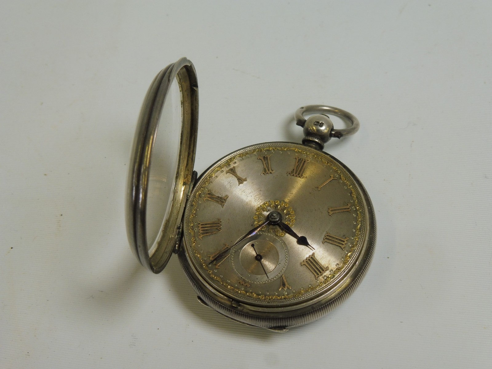 A good silver cased pocket watch with fusee movement, by M Young & Sons Newcastle, with yellow metal