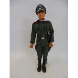 A 1970s Action Man with blond flock hair in a Geyper Man German staff officer's uniform.