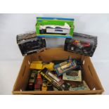 A box of assorted die-cast vehicles, differing makes and scales.