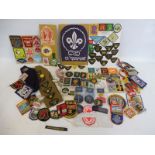 A quantity of girl guide and scout badges from the 1960s and 1970s.