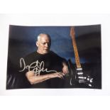 A signed Dave Gilmour guitar portrait photograph, our vendor tells us that this was signed at Nick