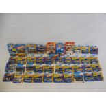 A quantity of carded Matchbox and Hot Wheels figures to include Batman, Batmobiles and others.