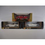 Three boxed Burago 1:18th scale models, boxes good, comprising Corvette, VW Beetle and Ford GT90.