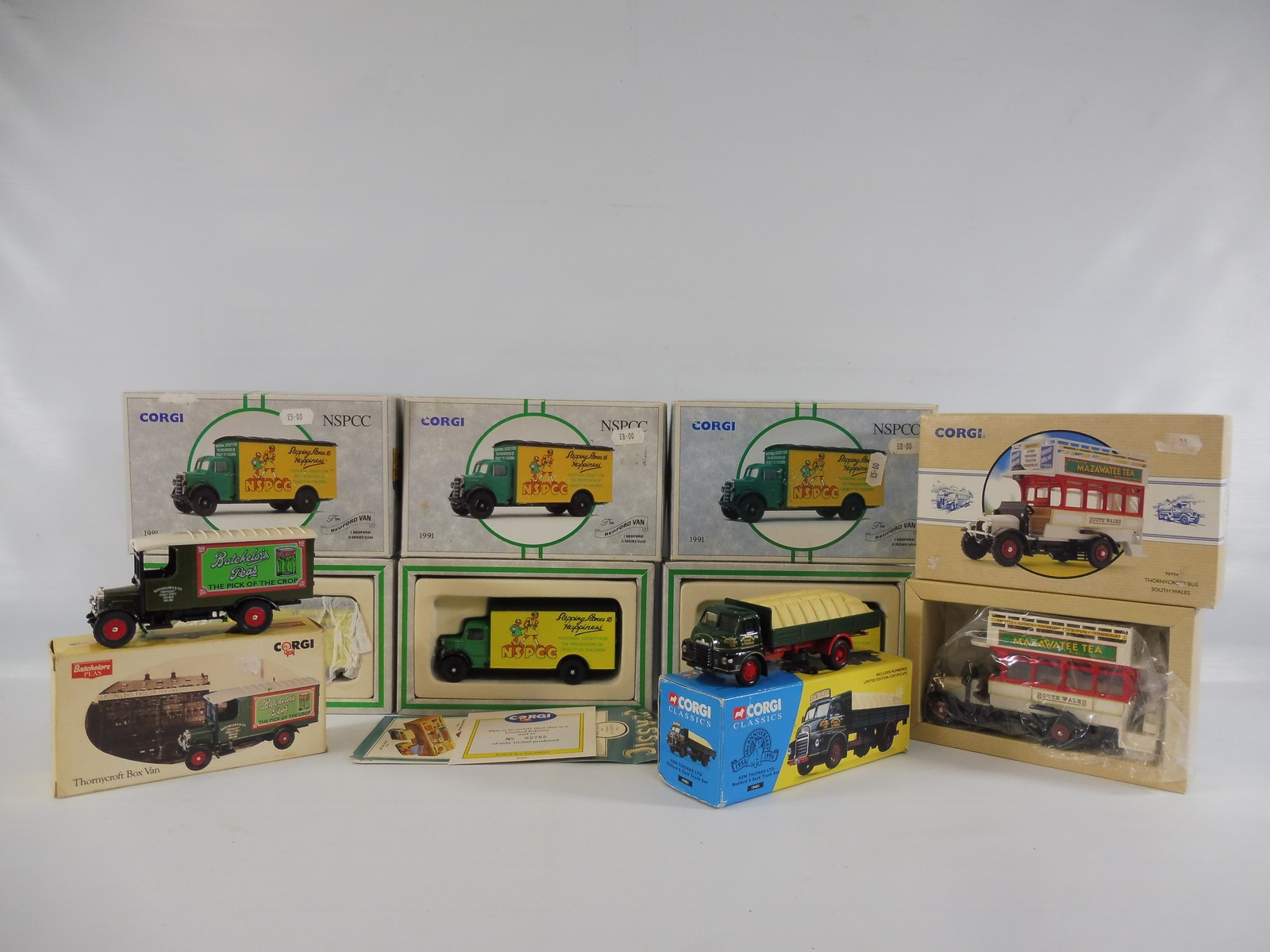 Six boxed Corgi Classics models to include a Thornycroft bus, NSPCC Bedford van etc.