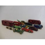 An assorted quantity of early Dinky Toys to include five racing cars, all in playworn condition.