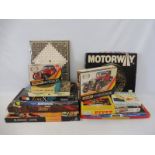 A quantity of mainly 1970s games, plus two Matchbox classic car kits, one sealed, appear to be in