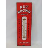 A Nut Brown Tobacco enamel thermometer in excellent condition, 7 1/2 x 22 1/2".