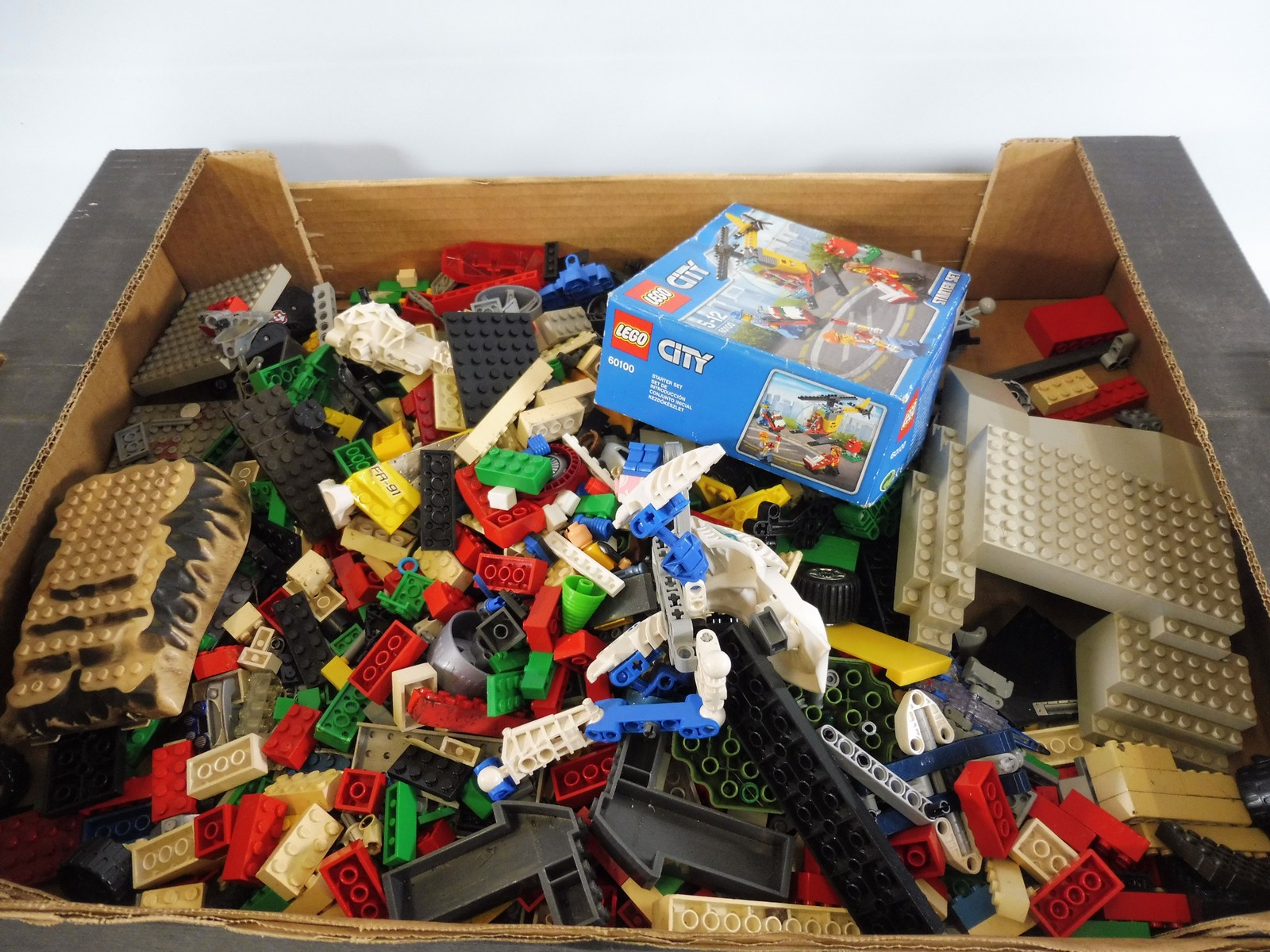 A box of Lego and Megablocks.