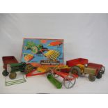 A boxed Mettoy Modern Farming Tractor set, incomplete and in playworn condition.