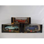 Three boxed Burago 1:18th scale models, all American supercars to include a 1957 Cheverolet