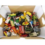 A box of die-cast vehicles including Matchbox and others.