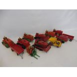 A mixed tray of mainly early Dinky Toys including eight bulldozers, heavy tractors and crawlers.