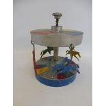 A folk art showman's built small scale carousel, by repute a finial from an amusement machine.