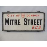 A City of London 'Mitre Street E.C.3.' milk glass sign set within an aluminium frame, 27 x 13 1/2".