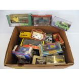 A quantity of mixed vehicles, mainly boxed, different scales and makers, including Ertl, Corgi etc.