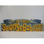 A fairground brightly coloured wooden sign 'He's Back Sponge Bob Square Pants', 70 x 20 1/4".