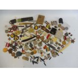 An interesting quantity of medals, military insignia badges, penknives, enamel badges etc.