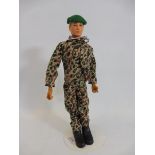 A circa 1970s Action Man figure, in a camouflage uniform.