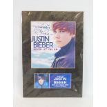 A signed photograph of Justin Bieber.