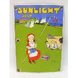 A reproduction Sunlight Soap pictorial enamel sign depicting a girl propping up the washing line, 14
