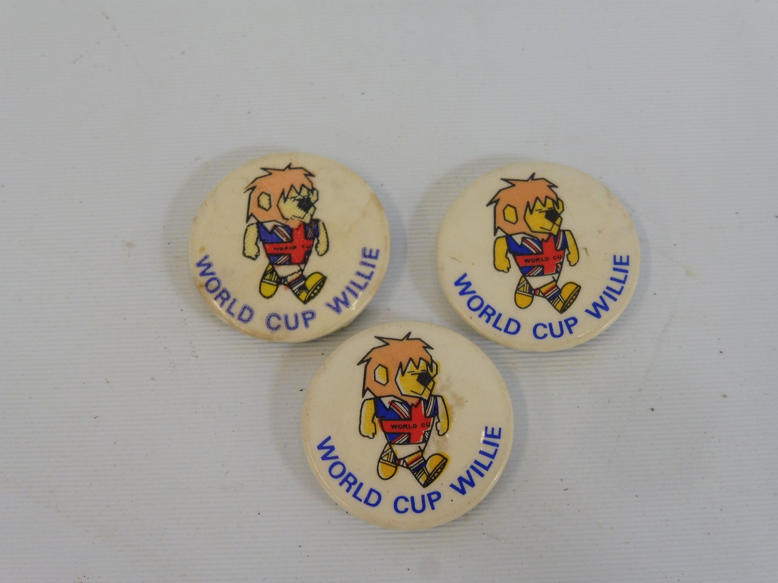 Three original World Cup Willy 1966 winner badges.