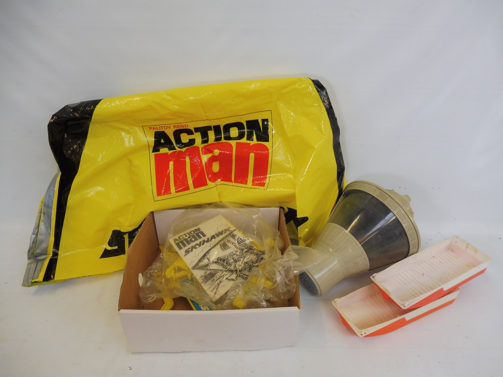 A box of Action Man to include a space capsule and others.