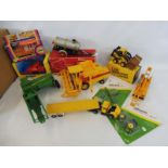A large quantity of mainly die-cast farm and haulage vehicles to include Britains, John Deere etc.