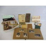 A quantity of early cigarette card albums, loose cards, booklets and bus tickets.