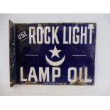 A Rock Light Lamp Oil double sided enamel sign with hanging flange, by Patent Enamel, 13 x 10".