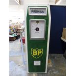 A contemporary and decorative wooden clock in the form of a petrol pump.