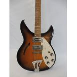 A signed electric guitar bearing the name Rickenbacker, signed personally at The Royal Albert Hall