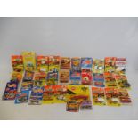 A quantity of Hot Wheels and Matchbox carded vehicles, mixed genres from American to commericals.