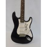 A Made in China Encore electric guitar, signed in large full signature by David Gilmour, this