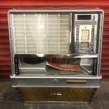 A late 1950s Rockola 100 wall mounted juke box, cabinet style, in full working condition, video of